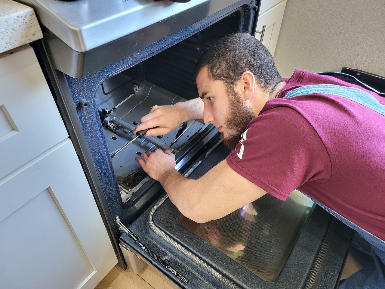 Technician repairing appliance